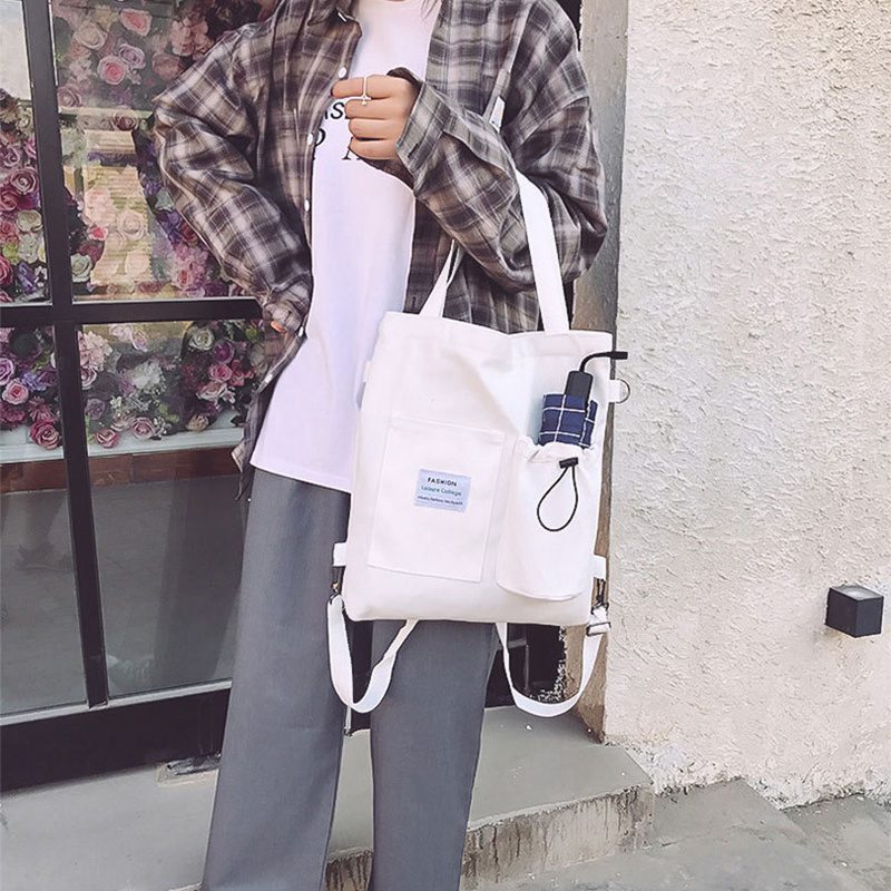حقيبة يد قماشية بنمط "هاراجوكو" للطلاب مزودة بجيوب، مناسبة للطراز الأكاديمي (Preppy Style)، وتصلح كحقيبة كتف أو حقيبة مدرسية للنساء. - الصورة 5