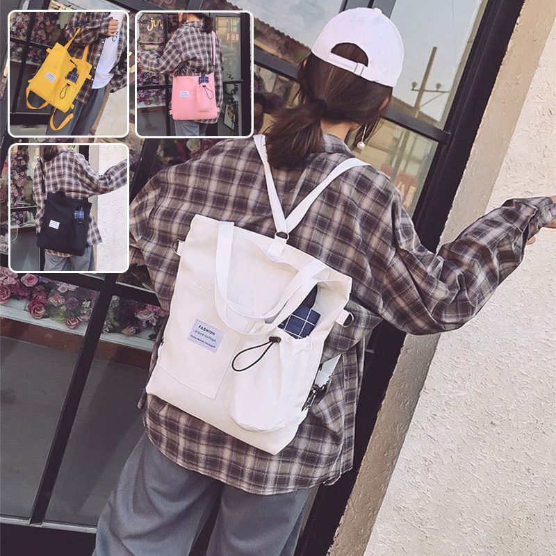 حقيبة يد قماشية بنمط "هاراجوكو" للطلاب مزودة بجيوب، مناسبة للطراز الأكاديمي (Preppy Style)، وتصلح كحقيبة كتف أو حقيبة مدرسية للنساء.