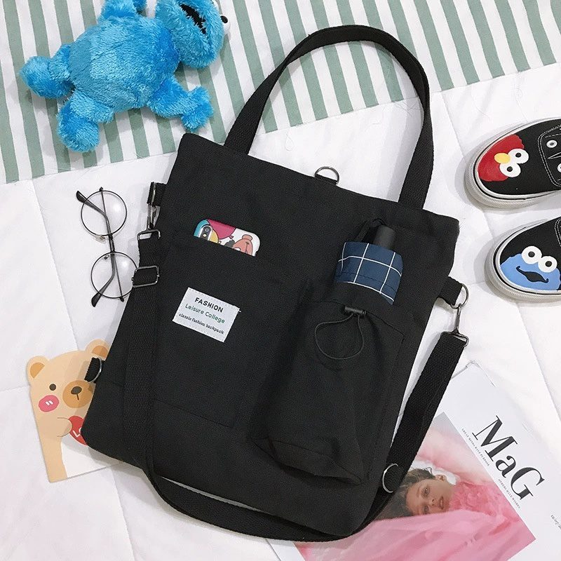 حقيبة يد قماشية بنمط "هاراجوكو" للطلاب مزودة بجيوب، مناسبة للطراز الأكاديمي (Preppy Style)، وتصلح كحقيبة كتف أو حقيبة مدرسية للنساء. - الصورة 9