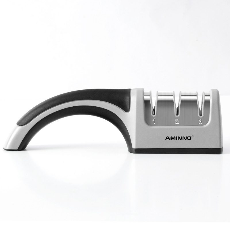 A Four-in-one Family Uses A Sharpener To Sharpen A Kitchen Knife - Image 10