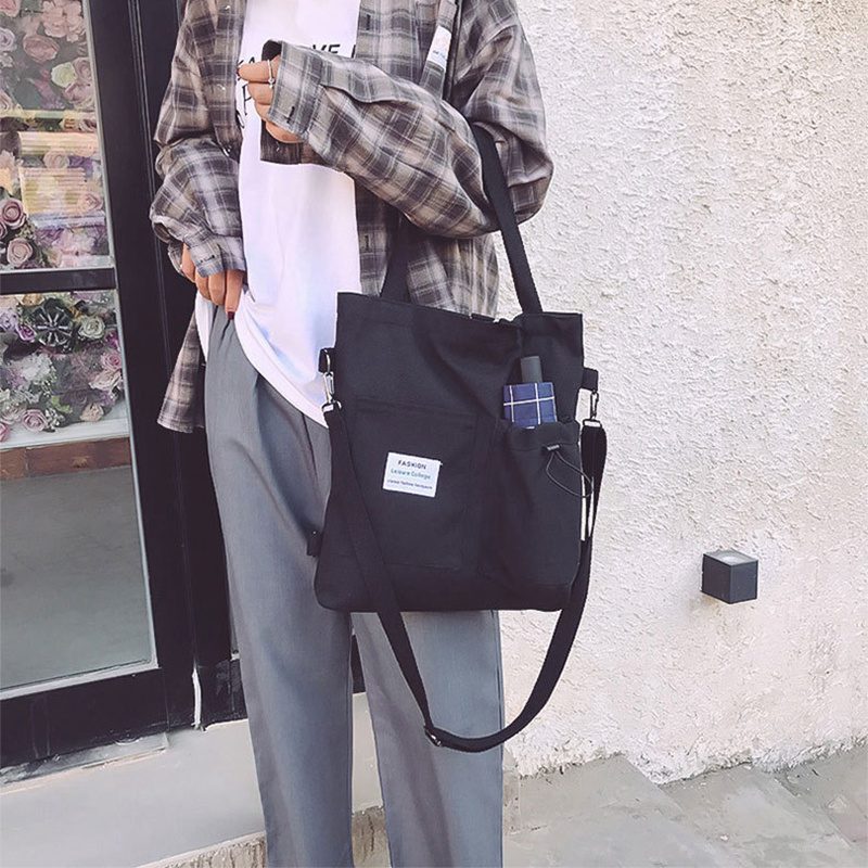 حقيبة يد قماشية بنمط "هاراجوكو" للطلاب مزودة بجيوب، مناسبة للطراز الأكاديمي (Preppy Style)، وتصلح كحقيبة كتف أو حقيبة مدرسية للنساء. - الصورة 2