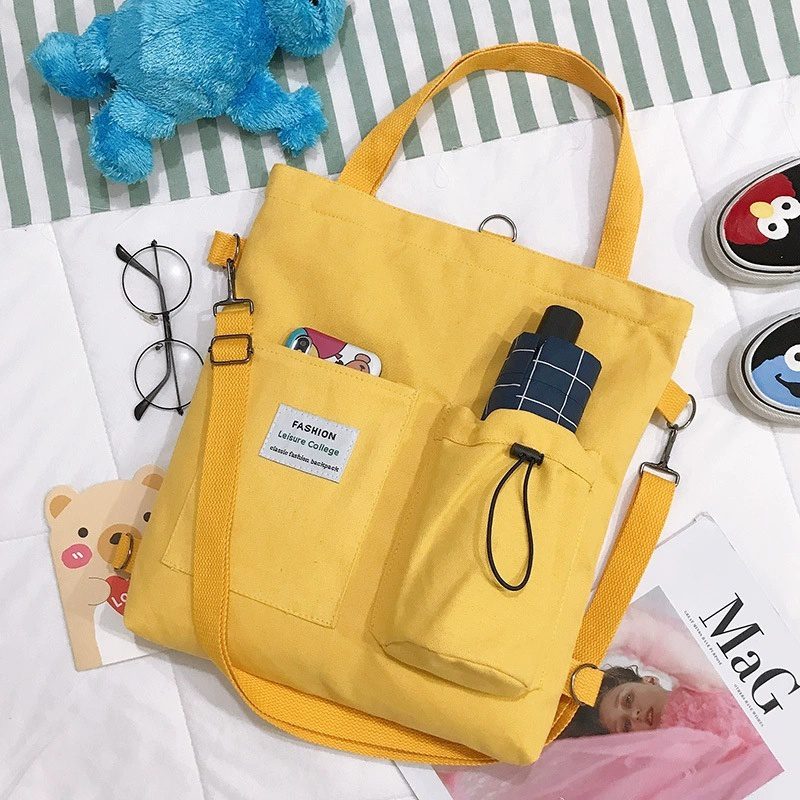 حقيبة يد قماشية بنمط "هاراجوكو" للطلاب مزودة بجيوب، مناسبة للطراز الأكاديمي (Preppy Style)، وتصلح كحقيبة كتف أو حقيبة مدرسية للنساء. - الصورة 10